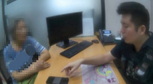 警員阻詐。林重鎣