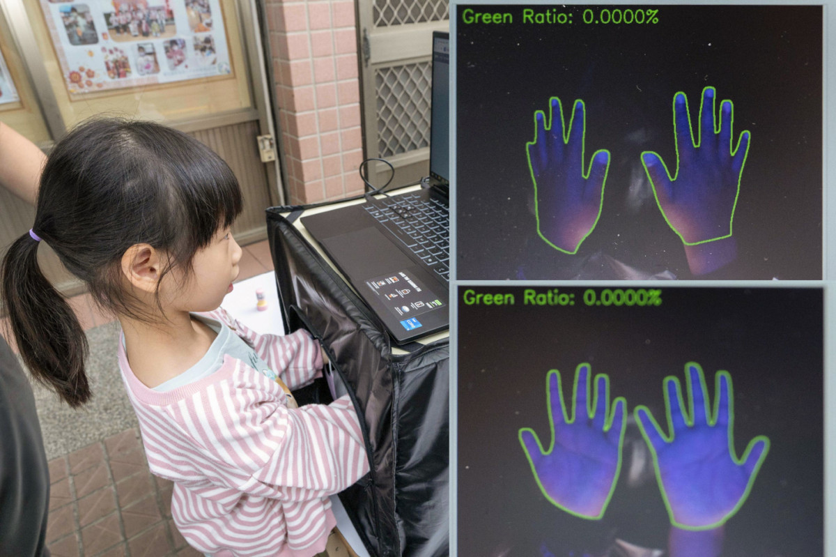 兒童將手伸入檢測箱，透過智能手部衛生評估教具，找出沒洗乾淨的盲點。圖／彰基醫院